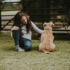 girl petting dog